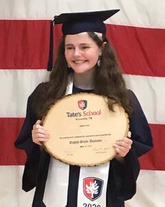 Student Holding Diploma